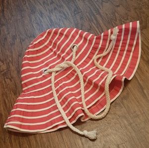 Pink baby bucket hat with White stripes.